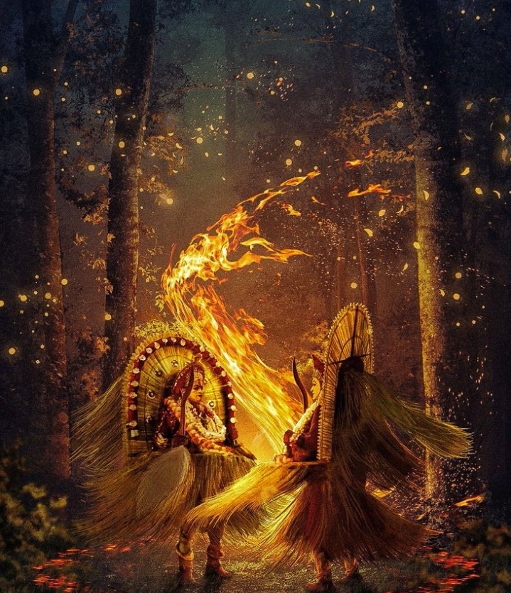 Two traditional dancers performing with flaming fire effects in a mystical forest at night, wearing elaborate costumes and headgear