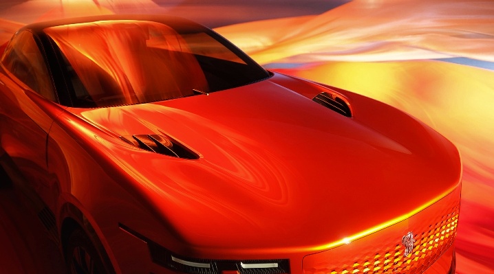 Front view of the luxurious red Toyota century 2025 under dramatic orange fabric lighting, showcasing it's bold grille and modern LED headlights.