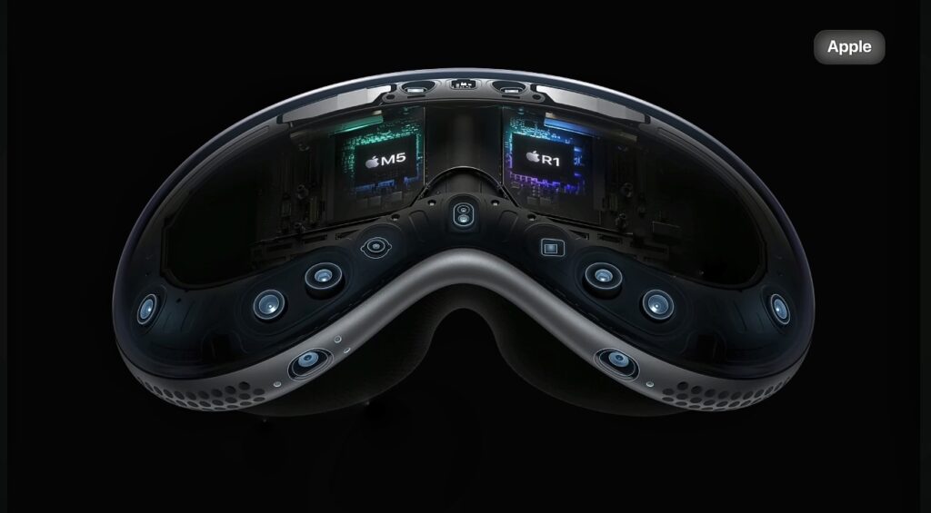 Apple vision pro headset featuring dual Apple M5 and R1 chip visible inside, surrounded by multiple sensors and cameras.
